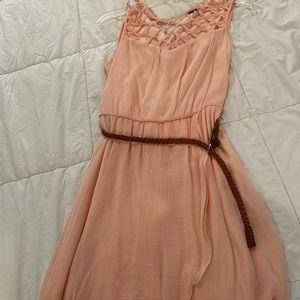 Light pink dress with thin brown belt.